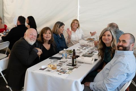 Home Tour guests sitting at dinner table